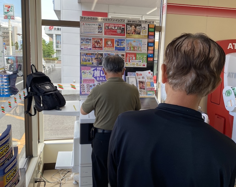Queue for the photocopy/printing machine at a 7-11 in Nagano, Japan.